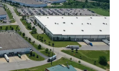 Blog Thumbnail Wide  Distribution center with truck delivering and collecting goods