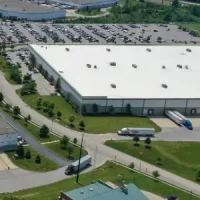 Blog Thumbnail Wide  Distribution center with truck delivering and collecting goods