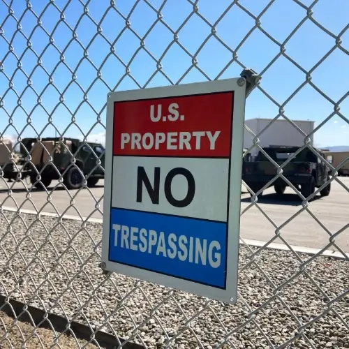 No Trespassing sign attached to a chain link