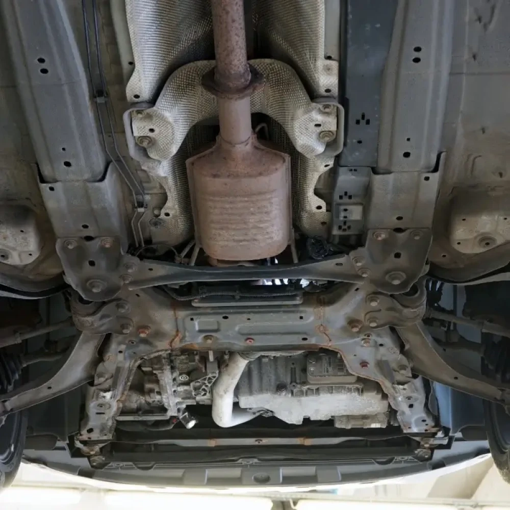 Bottom view of a car showing catalytic converter.
